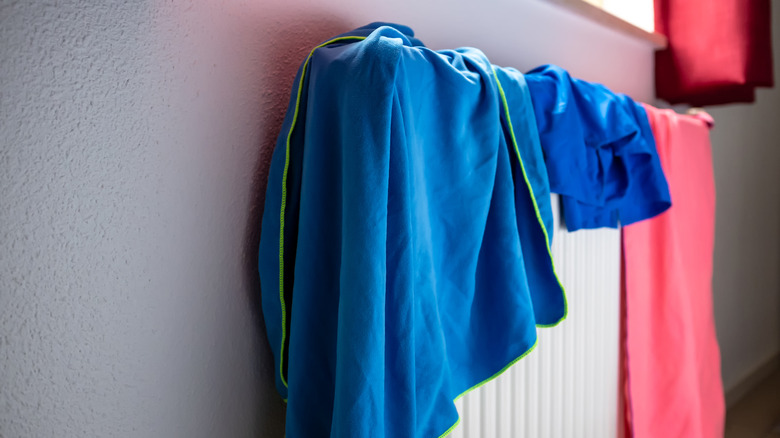 towels drying on a rack