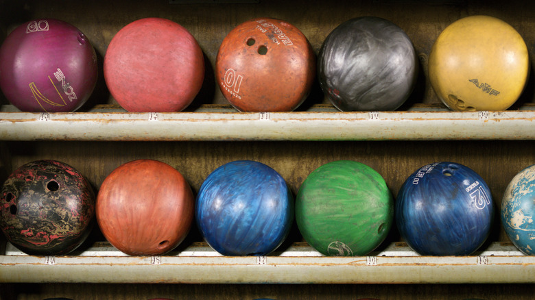 Multi-color bowling balls on a shelf