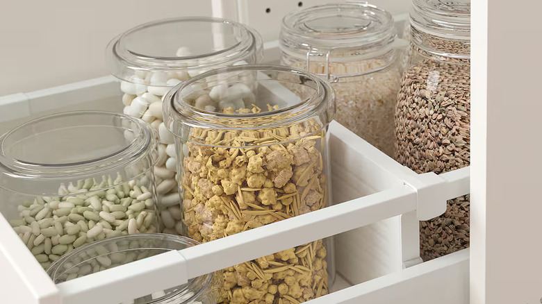 Glass jars of food between IKEA dividers