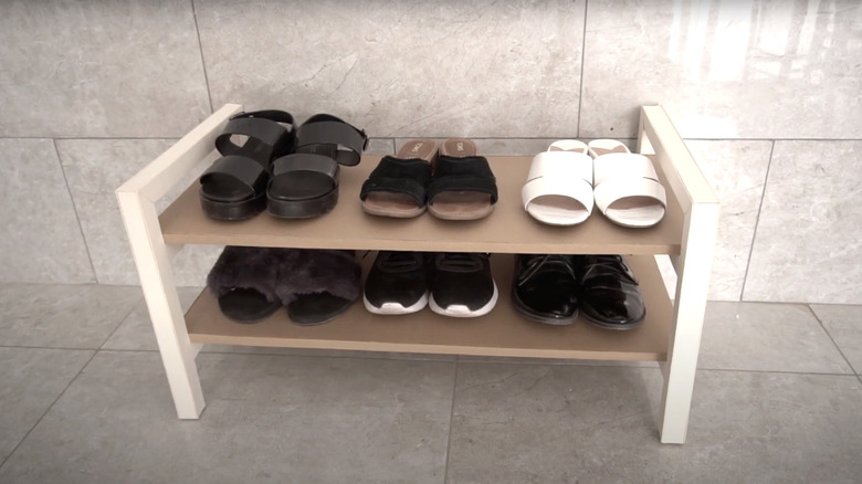 DIY cardboard shelf with women's shoes