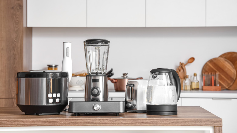 Different kitchen appliances on kitchen counter.