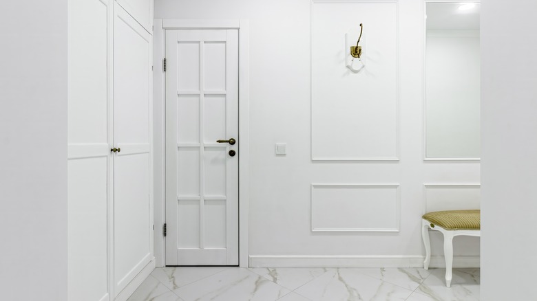 entryway with closed storage cabinets