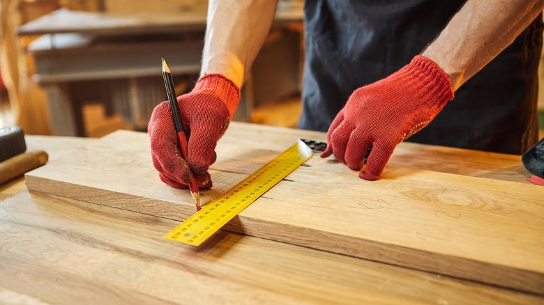 measuring a piece of wood 