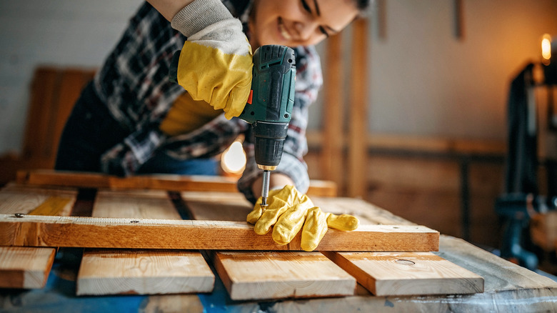 woman using screwdriver