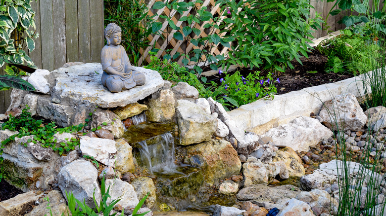 Buddha statue on water feature