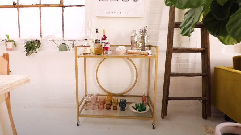 gold bar cart with glass