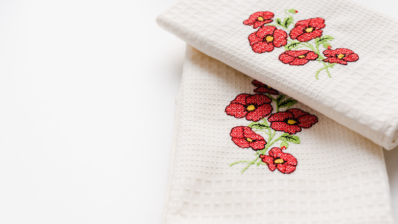 white tea towel with floral embroidery