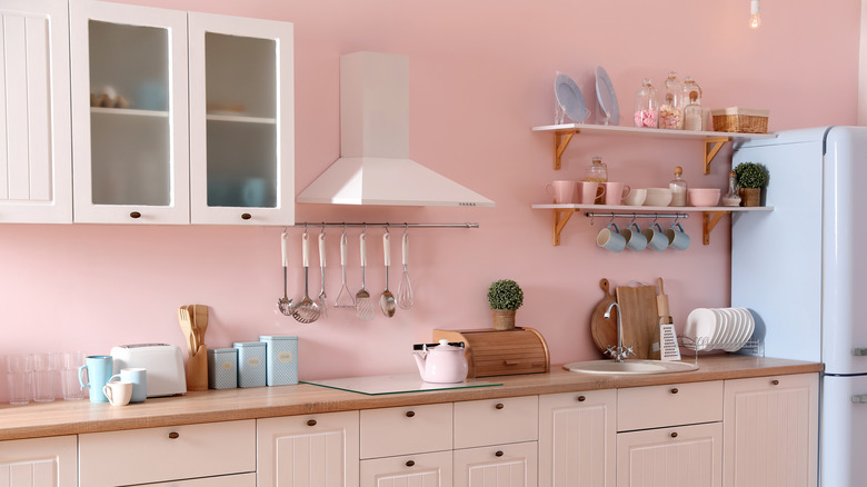 kitchen with pastel pink wall paint