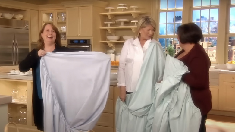 three women folding sheets