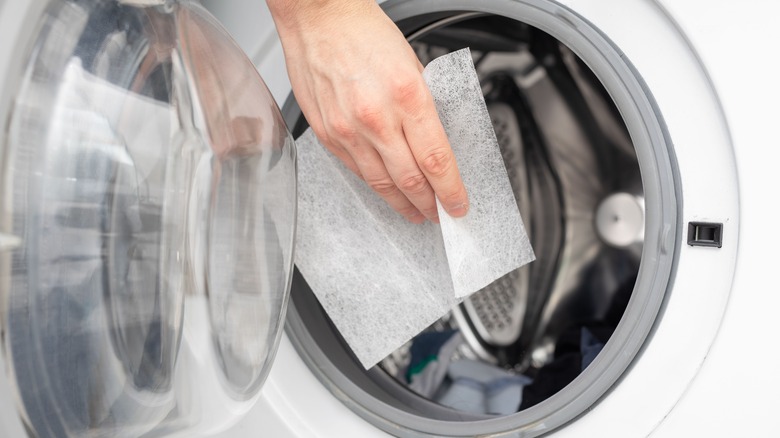 hand holding dryer sheet