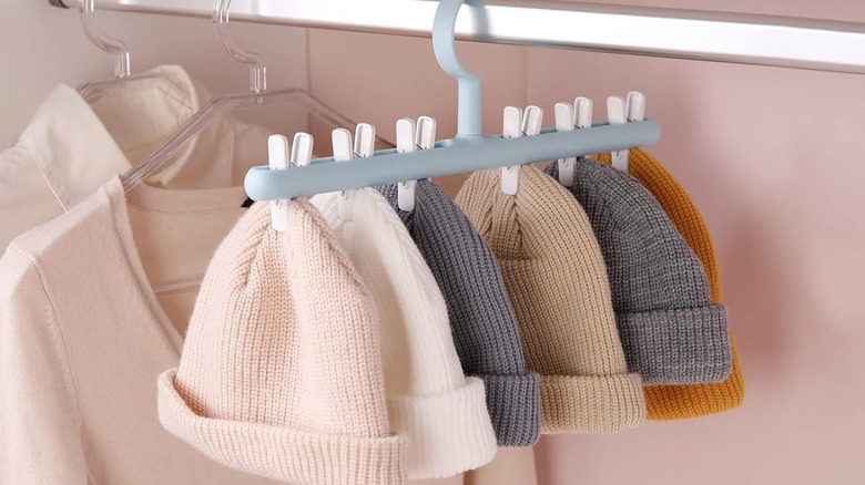 A Yesesion Hat Organizer with winter hats