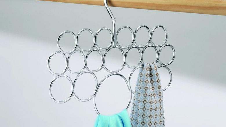 A scarf hanger in a closet