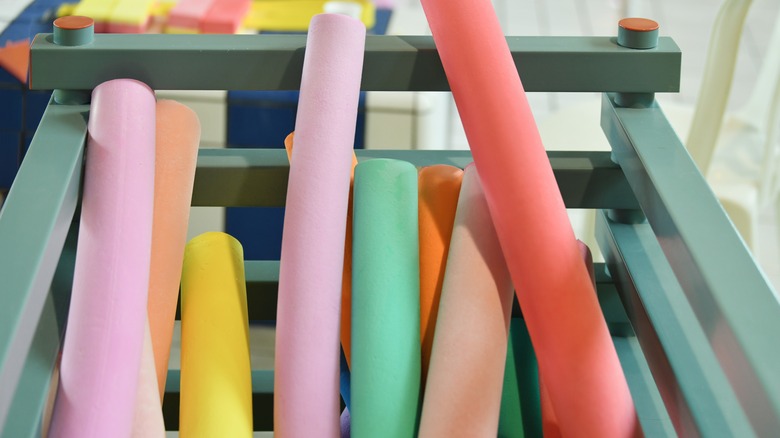 pool noodles in bin