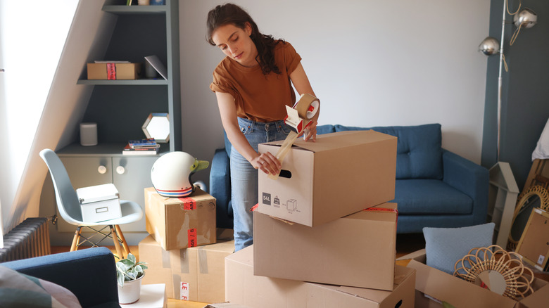 Person packing moving boxes