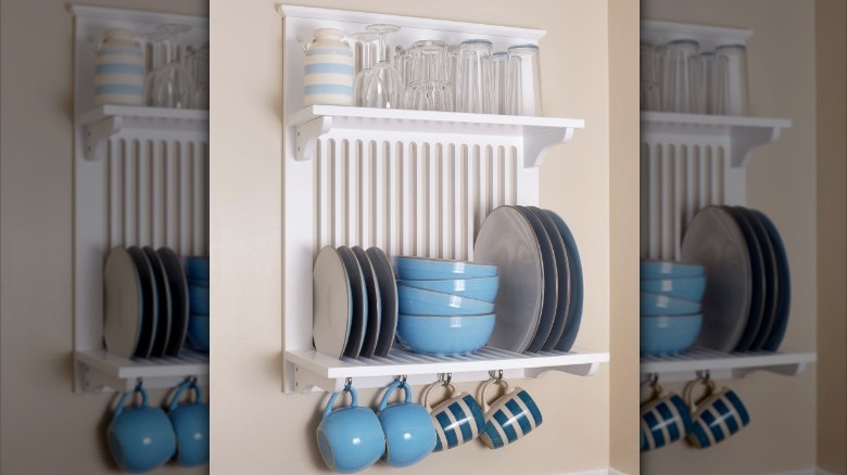 mugs hanging on dish rack