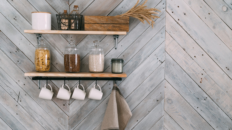 white mugs on black hooks