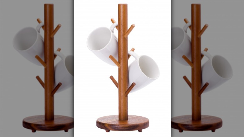 white mugs on wooden tree