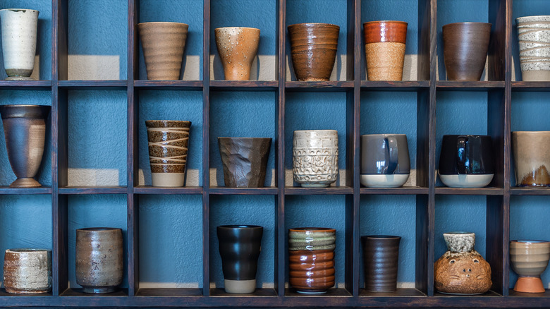 mugs in blue cubbies