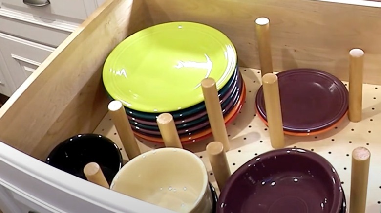 drawer with pegboard and dishes