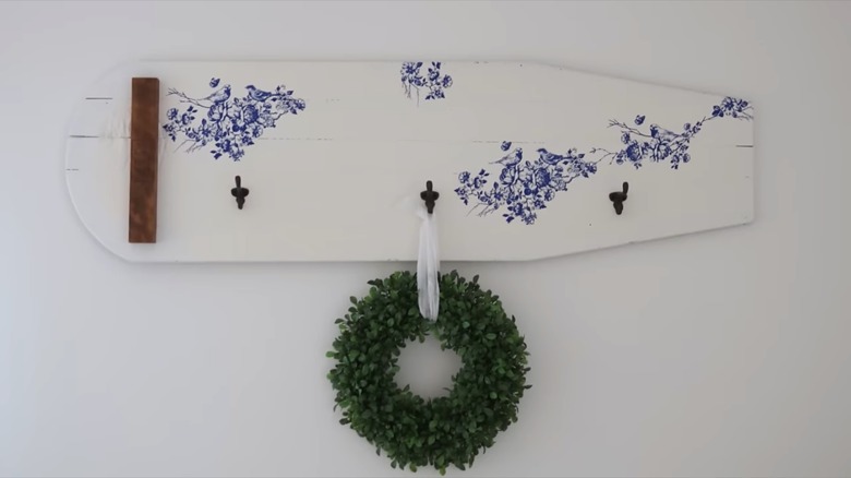 mounted wooden ironing board with hooks 