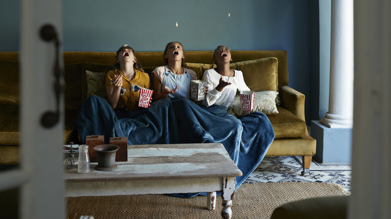 Tweens relaxing on couch