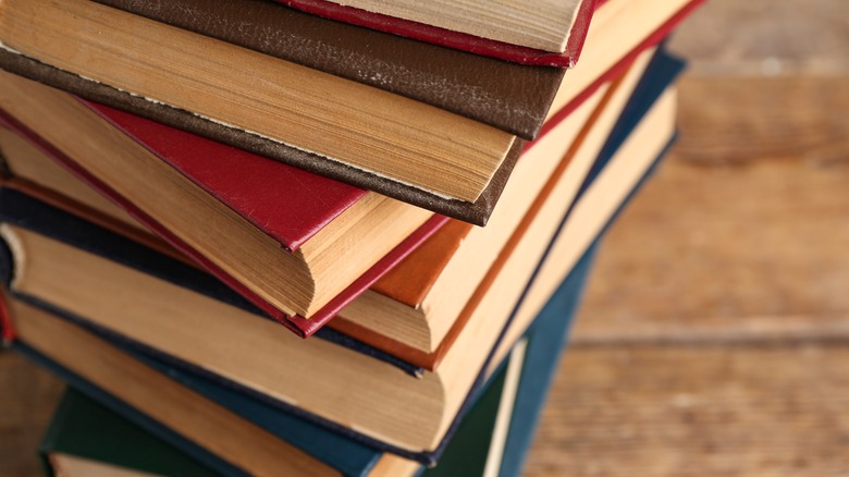 Stack of old books on table