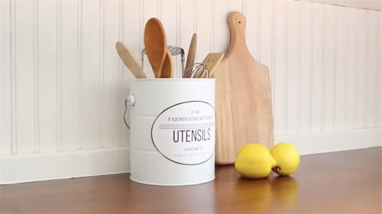 kitchen utensils in paint can