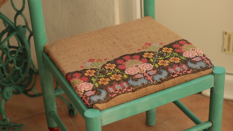 embroidered cushion on chair