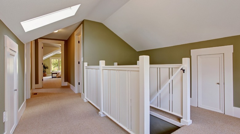 Hallway with stairs and skylight