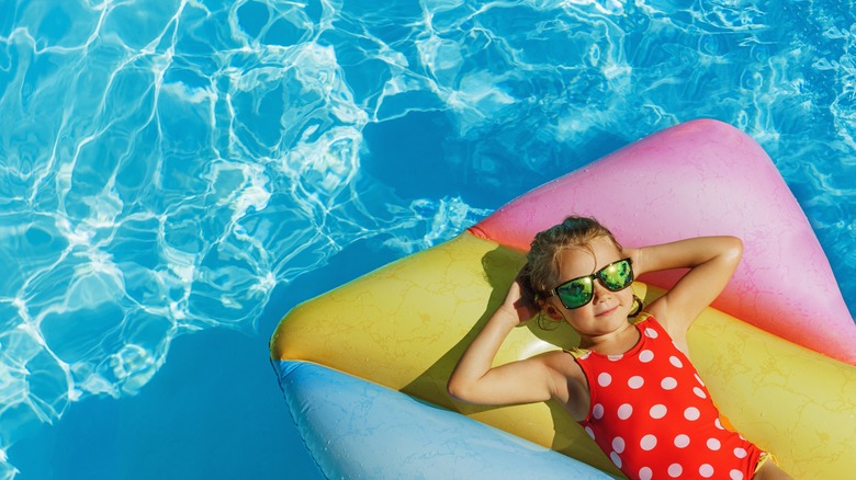 kid in warm pool