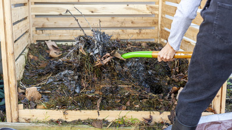 Turning compost in bin