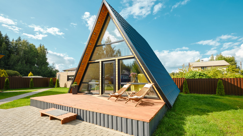 A frame house in a backyard