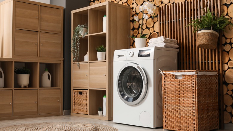 Brown cube organizer in laundry room next to washer