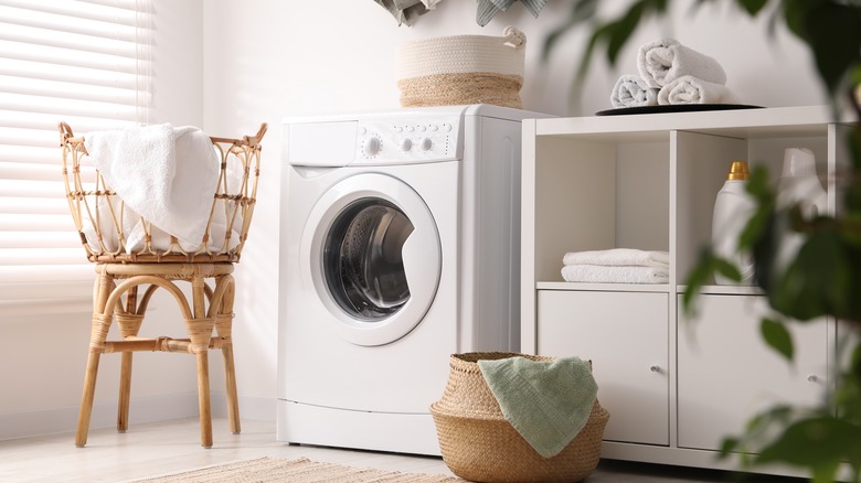 Laundry room with white cube organizer