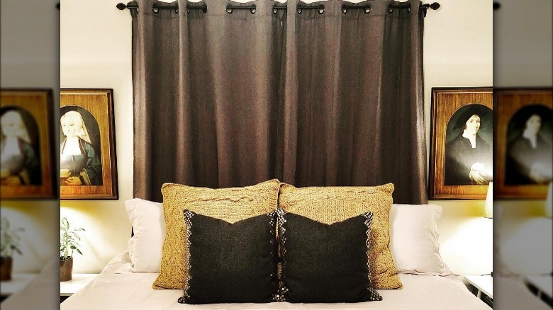 Curtain behind bed with pillows