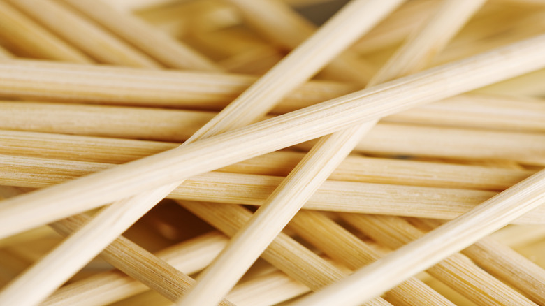 Close-up image of stack of wooden dowels