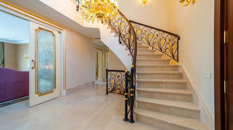 Sleek marble flooring and staircase in a luxury home