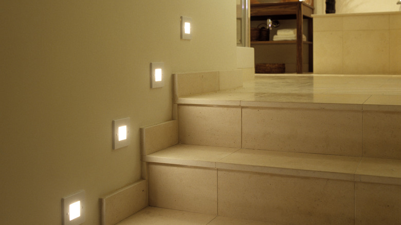 Marble staircase with recessed lights in the walls