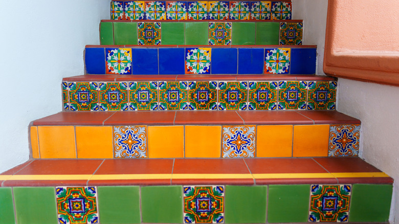 Colorful mosaic tiles on stair risers in a home