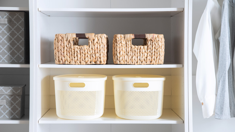 Storage basket on shelves in closet