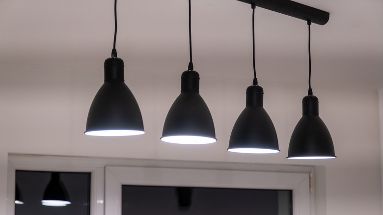 black metal pendant lights in a kitchen