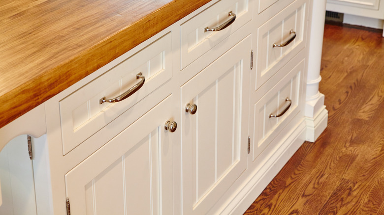 Kitchen cabinets with polished chrome hardware