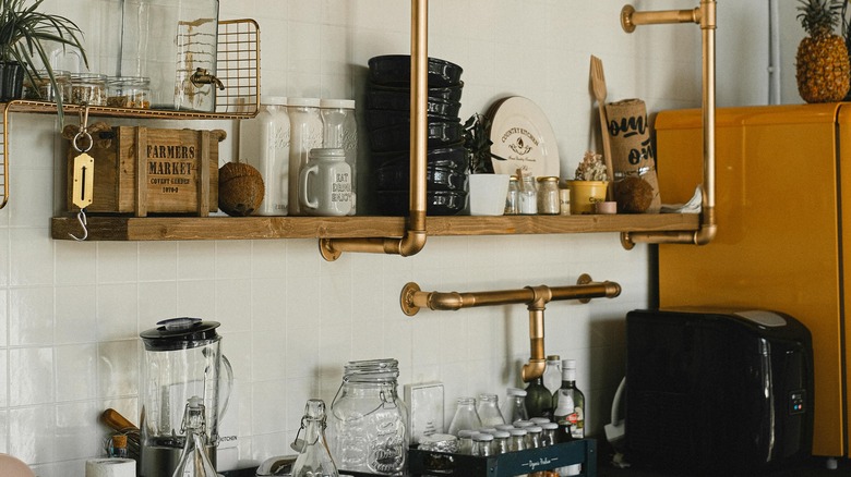 a kitchen shelf with bronze metal