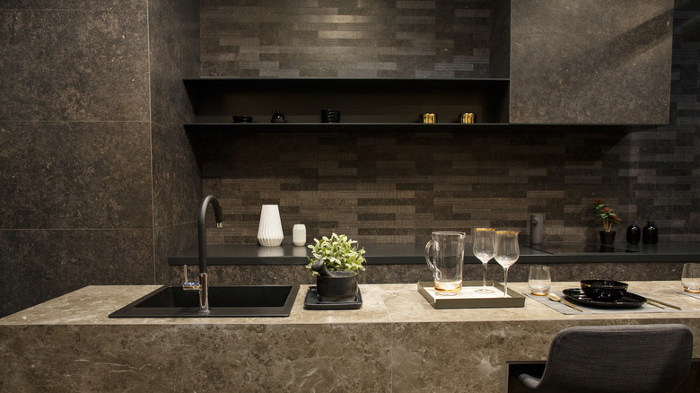 a dark kitchen made of stone