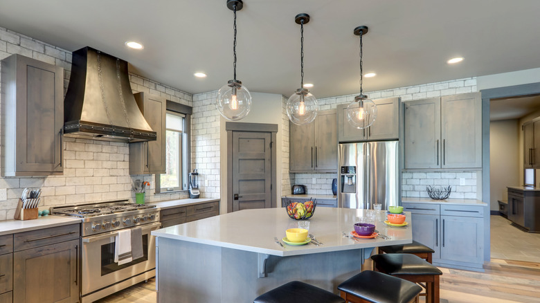 a kitchen featuring muted steels and gray colors