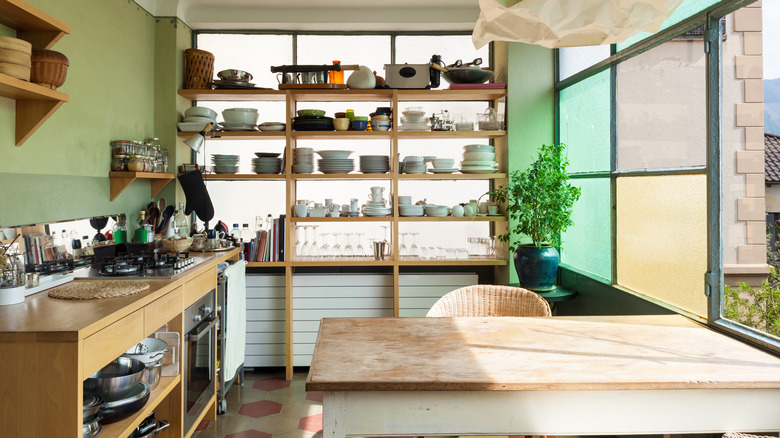 a bright kitchen with open wood shelves