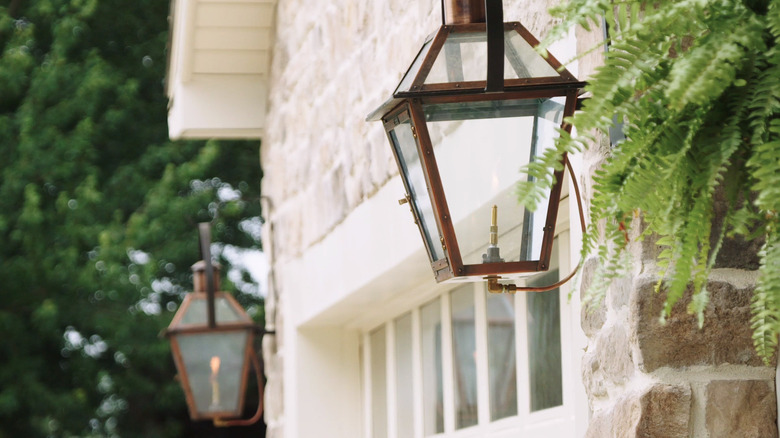 Gas lanterns by garage door