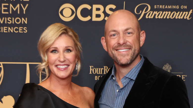 Jenny and Dave Marrs on a red carpet.