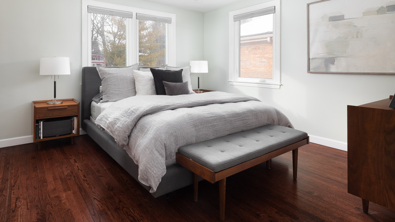 White bedroom with dark woodwork