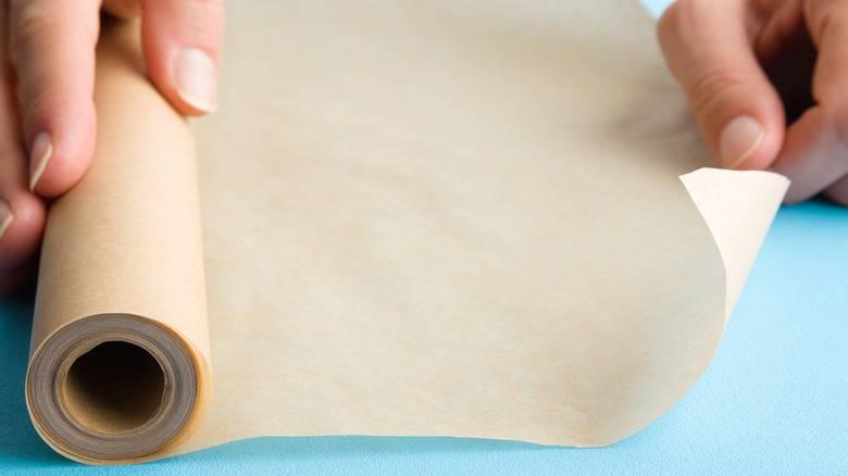 unrolling roll of wax paper 